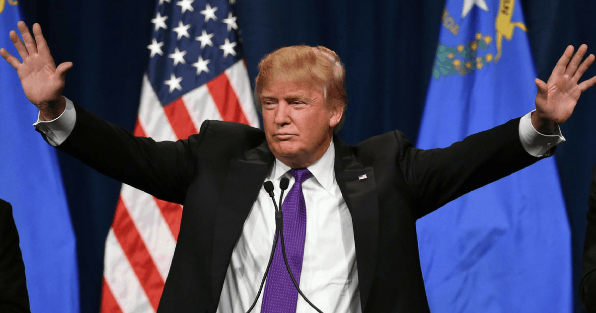 Trump raising his arms in triumph