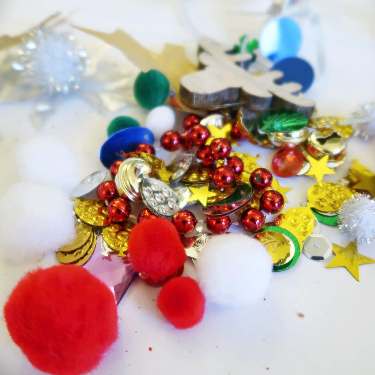 Sensory Bauble Craft - sequins and pom poms and stars in green, red and gold