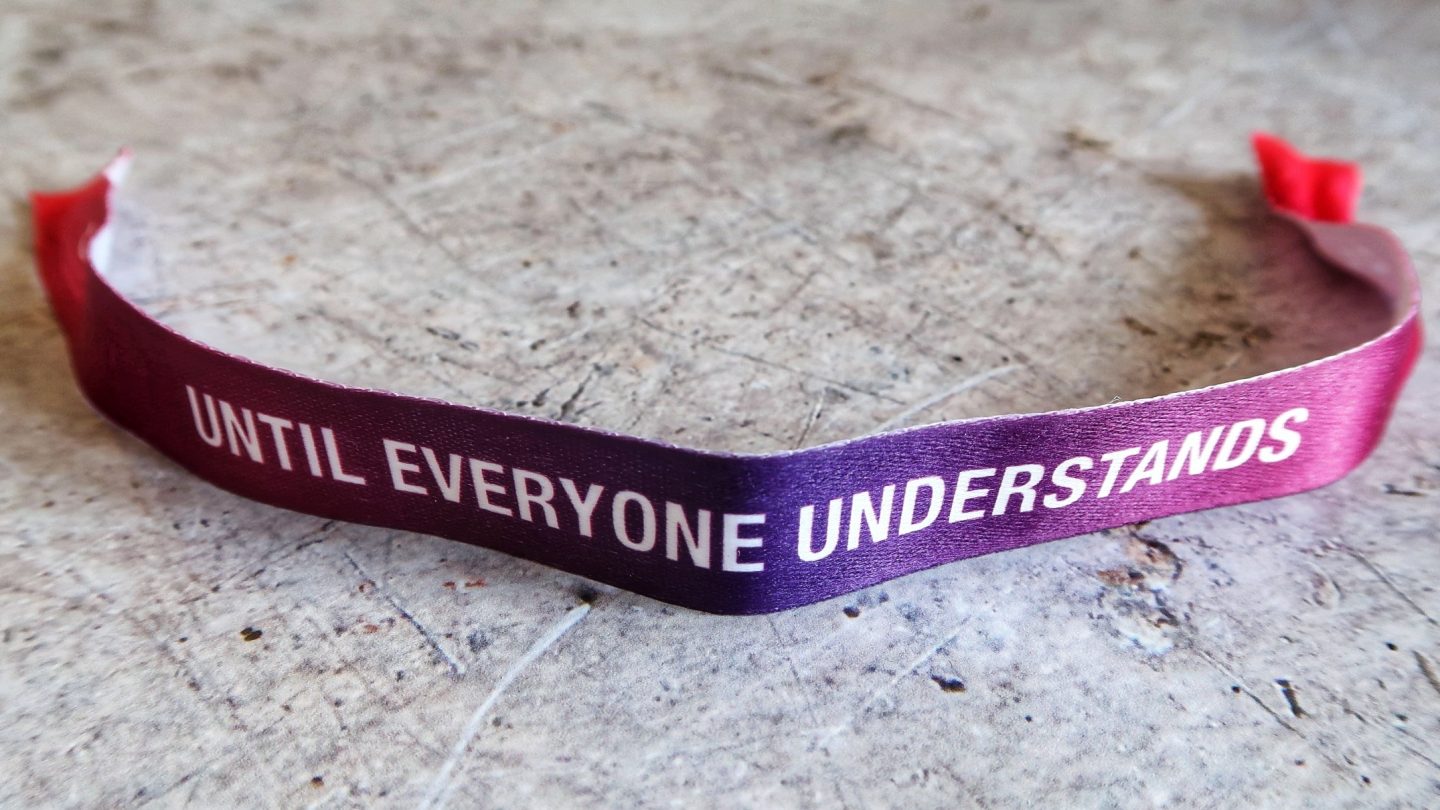Autism Awareness wristband that reads "Until Everyone Understands"