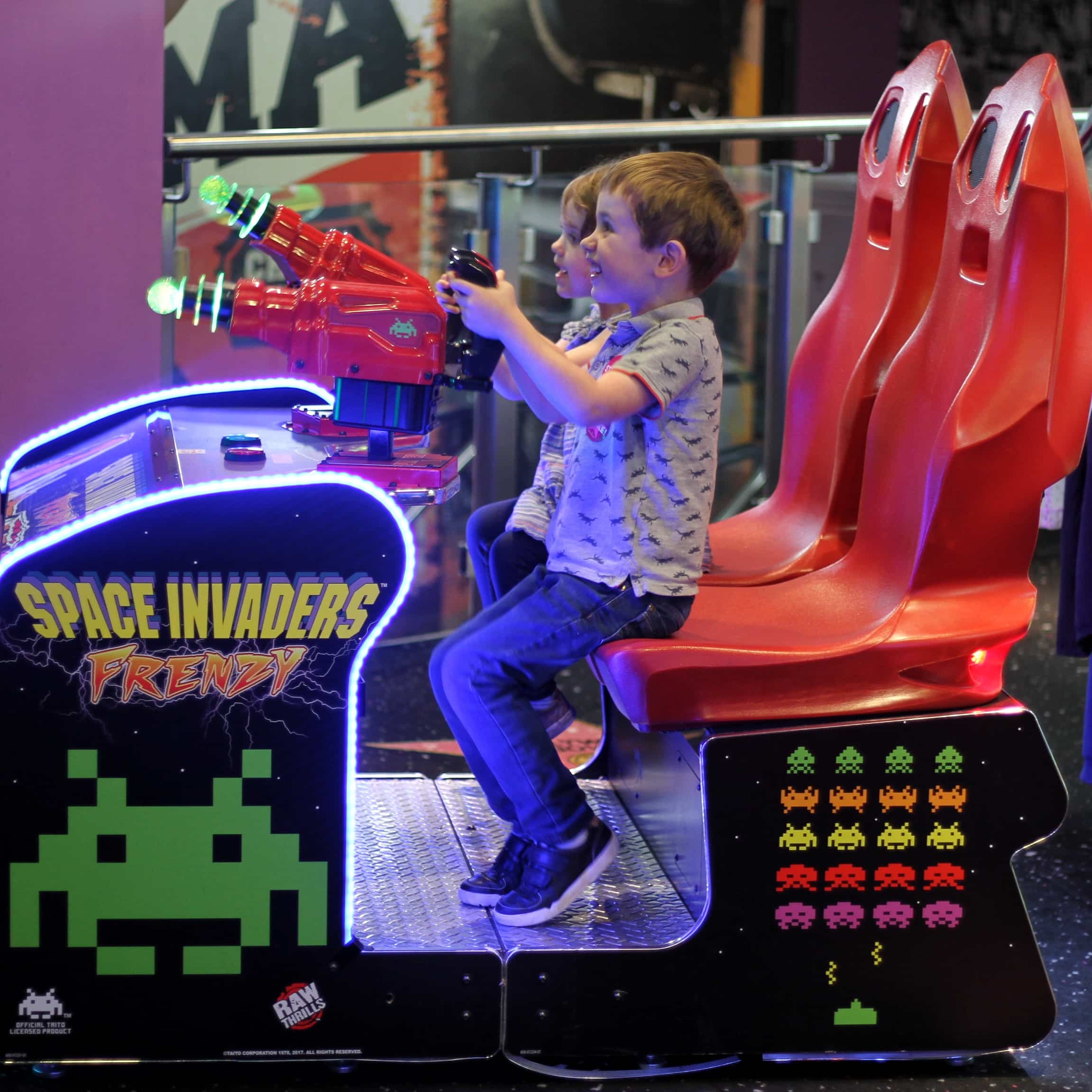 Biggest and Littlesy playing Space Invaders