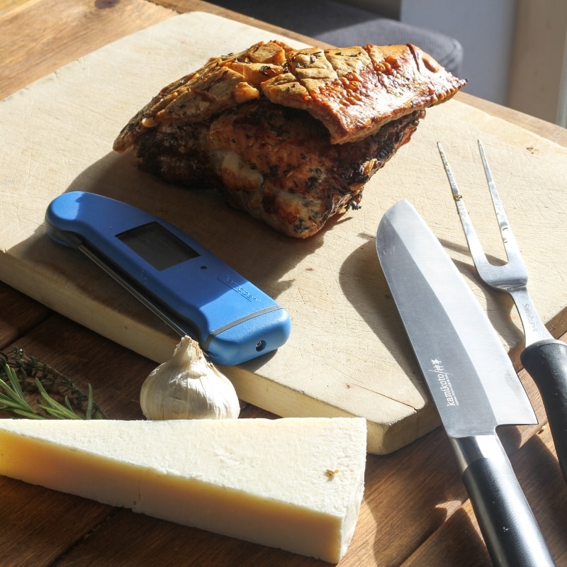 Herb Encrusted Pork Loin Stuffed with Garlic and Pecorino with thermapen and pecorino cheese