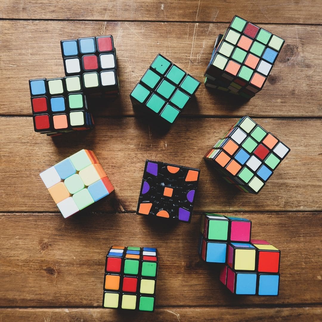 A large collection of different types of Rubik's cubes